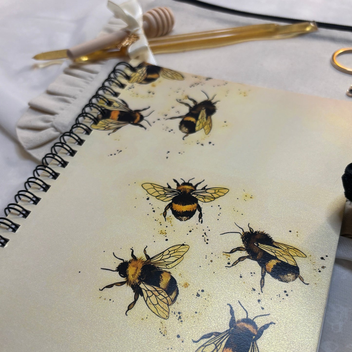 Pouch with bee designs on a white background